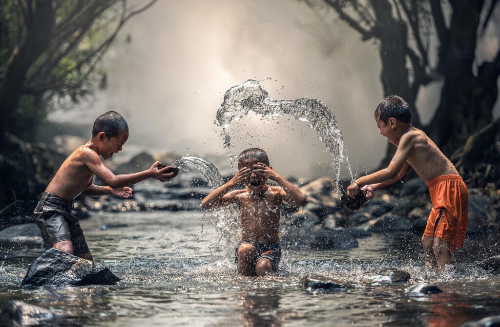 kids playing water fun laughter simple things